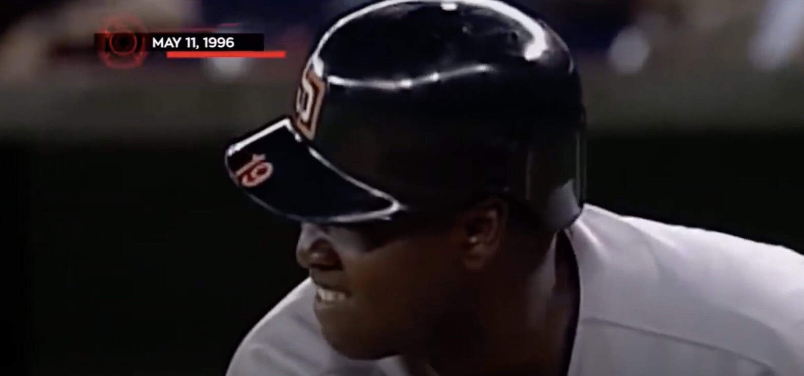 Image of Tony Gwynn demonstrating his batting skills in a hitting clinic.